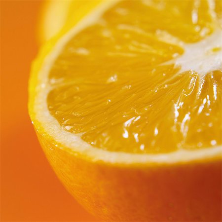 simsearch:652-07656127,k - Close-up of half an orange Photographie de stock - Rights-Managed, Code: 825-07078258