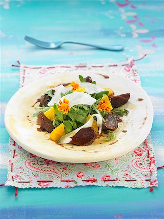 Eel,duck gizzard,rocket lettuce,orange and edible flower salad Stock Photo - Rights-Managed, Code: 825-07522265