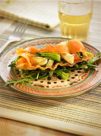 smoked salmon - Smoked salmon,smoked cod and pak-choy cabbage on crisp wonton pasta Stock Photo - Rights-Managed, Code: 825-07522278