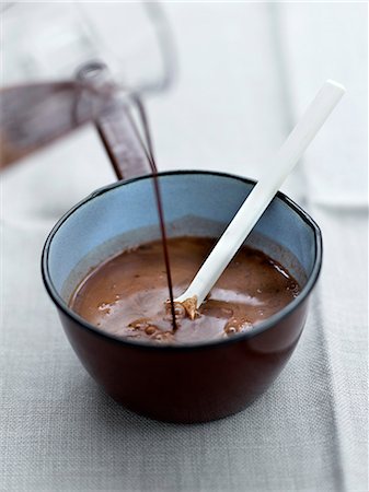 Adding the melted chocolate to the cocoa-sugar Stock Photo - Rights-Managed, Code: 825-07522853