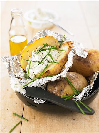 Baked potatoes with cottage cheese and herbs Stock Photo - Rights-Managed, Code: 825-07522907