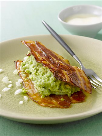 Crisp streaky bacon with broad bean mash Stock Photo - Rights-Managed, Code: 825-07523124