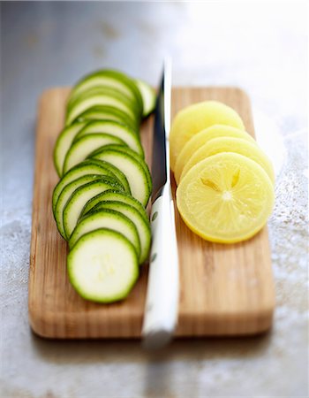 round slice - Slicing zucchinis and confit citrus Stock Photo - Rights-Managed, Code: 825-07649238