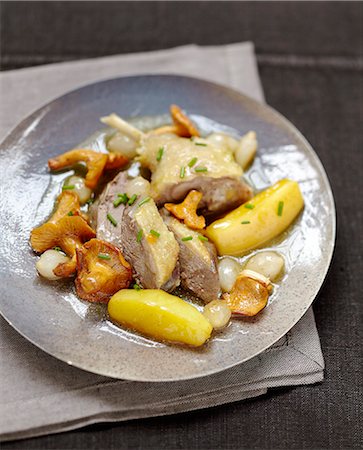 simsearch:652-07655870,k - Duck à l'étouffée with chanterelles and potatoes Stock Photo - Rights-Managed, Code: 825-07649291