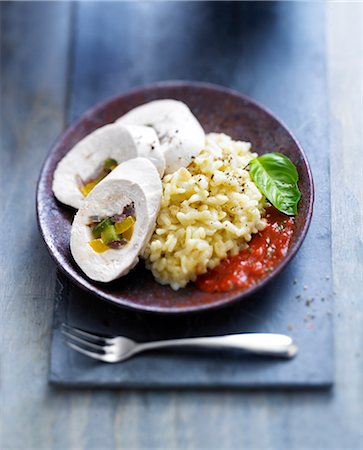 simsearch:652-07655492,k - Rolled chicken breasts stuffed with peppers,risotto and tomato and pepper sauce Photographie de stock - Rights-Managed, Code: 825-07652596