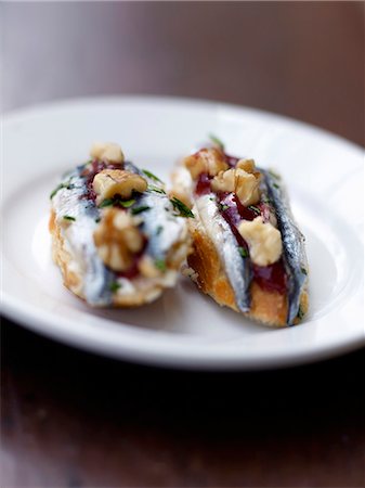 Anchovy,tomato sauce and walnut Pintxos Stock Photo - Rights-Managed, Code: 825-07652714