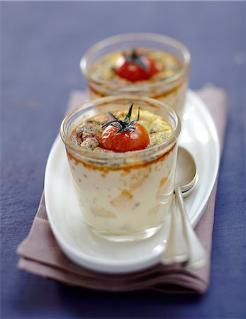 simsearch:652-05807192,k - Parmesan,herb and cherry tomato individual flans Photographie de stock - Rights-Managed, Code: 825-07652965