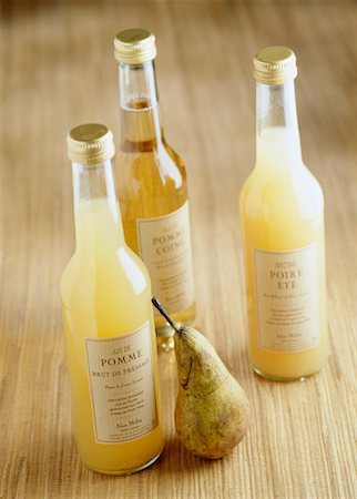 fruit juice in bottles - Bottles of apple juice,pear juice and quince juice Stock Photo - Rights-Managed, Code: 825-02304373