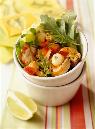 Pan-fried seafood with lemon and rocket Stock Photo - Rights-Managed, Code: 825-02304530