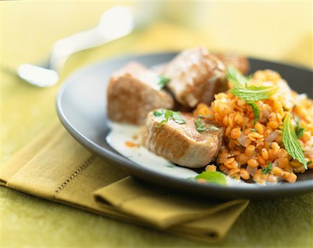 Sauteed porc with orange lentils Stock Photo - Rights-Managed, Code: 825-02304757