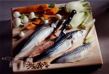 cutting up mackerel and vegetables Stock Photo - Rights-Managed, Code: 825-02305448