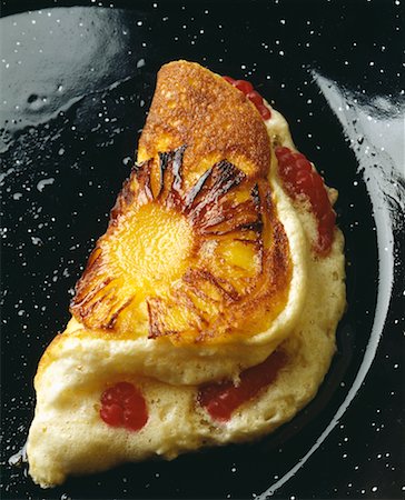 fluffy omelette with pineapple and raspberry Stock Photo - Rights-Managed, Code: 825-02306295