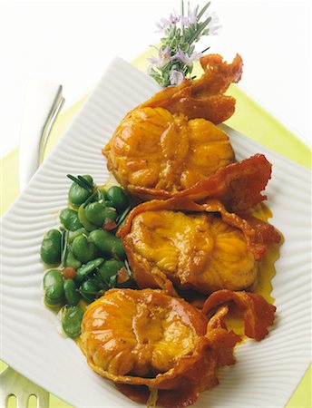 curried monkfish wrapped in bacon with broad beans Stock Photo - Rights-Managed, Code: 825-02306291