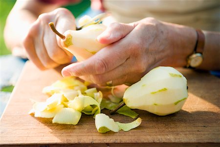 fruit flesh - woman peeling pears Stock Photo - Rights-Managed, Code: 825-02306870