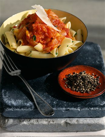 simsearch:825-02304010,k - Penne with tomato sauce,onions and flakes of parmesan Stock Photo - Rights-Managed, Code: 825-02307213