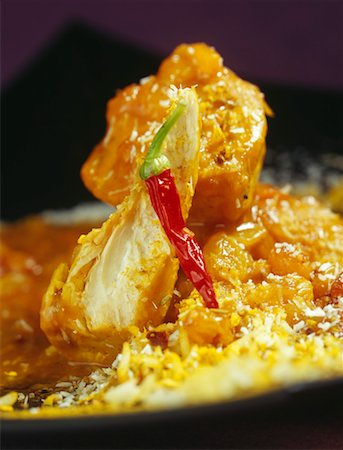 simsearch:825-02307165,k - Chicken curry with two chutneys Foto de stock - Direito Controlado, Número: 825-02307462