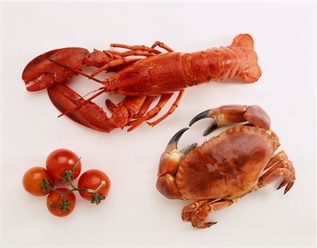 Lobster,crab and tomatoes Foto de stock - Con derechos protegidos, Código: 825-02302751