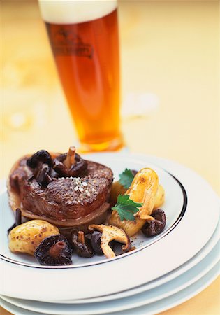 Tournedos steak with mushrooms and a glass of beer Stock Photo - Rights-Managed, Code: 825-02303128