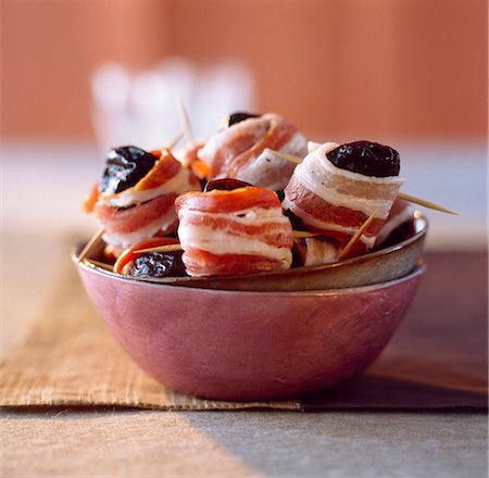 Prunes wrapped in bacon Stock Photo - Rights-Managed, Code: 825-03627007