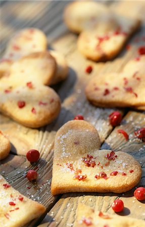 Heart-shaped shortbread biscuits with pink peppercorns Stock Photo - Rights-Managed, Code: 825-03627687