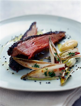 Beef fillet with black sesame seed crust and pan-fried chicory Stock Photo - Rights-Managed, Code: 825-03627933