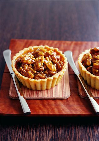 Caramelized walnut tartlets Stock Photo - Rights-Managed, Code: 825-03628156