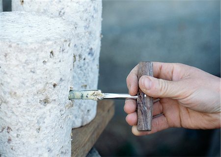 Checking the maturing Fourme d'Ambert with a cheese drill Fotografie stock - Rights-Managed, Codice: 825-03628200