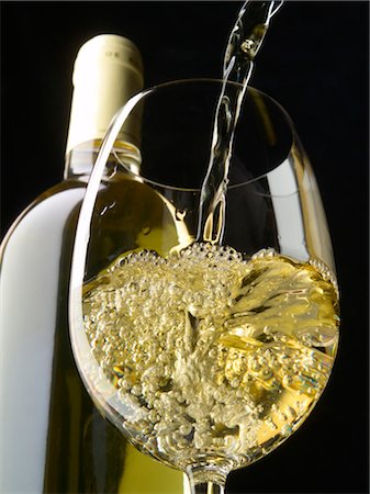 pouring a glass of white wine Stock Photo - Rights-Managed, Code: 825-03628260