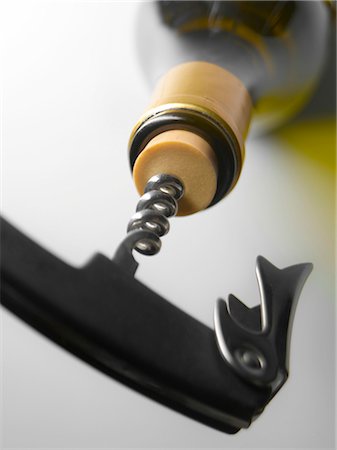 simsearch:652-02222200,k - Openning a bottle of wine with a corkscrew Stock Photo - Rights-Managed, Code: 825-03628262