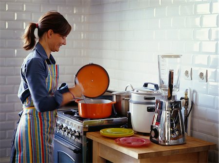 pots on a stove - Mixing the preparation in the cooking pot Stock Photo - Rights-Managed, Code: 825-03628521