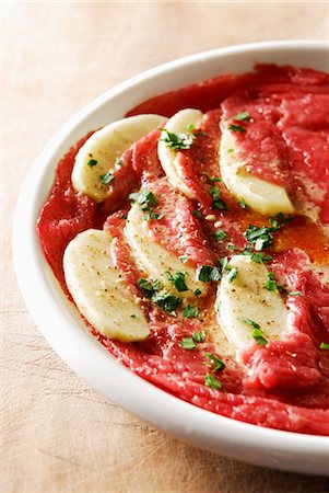 Beef and apple carpaccio with olive oil Fotografie stock - Rights-Managed, Codice: 825-03628644