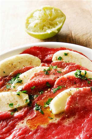 Beef and apple carpaccio with olive oil Fotografie stock - Rights-Managed, Codice: 825-03628645