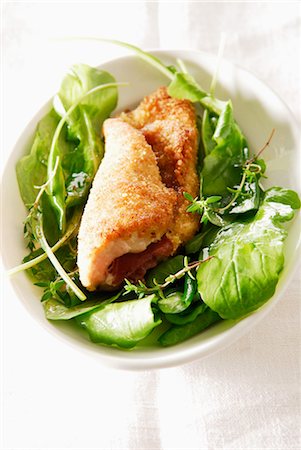 Breaded escalope with mozzarella and raw ham,spinach and rocket salad Stock Photo - Rights-Managed, Code: 825-03628657