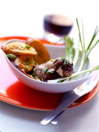 Chicken meatballs with pan-fried potatoes Stock Photo - Rights-Managed, Code: 825-03628934