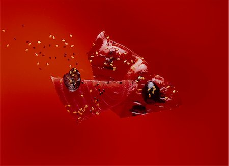 food, abstract - Red tuna Sashimi with sesame seeds and red grilled pepper Stock Photo - Rights-Managed, Code: 825-03629013