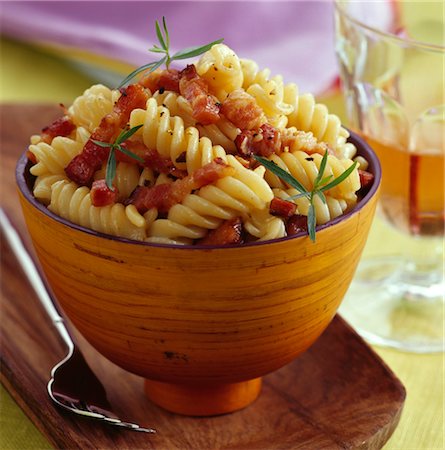 short pasta - Fusillis with diced bacon Stock Photo - Rights-Managed, Code: 825-03629035