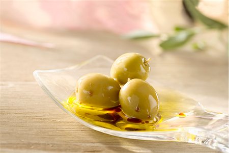 Green olives in french dressing Fotografie stock - Rights-Managed, Codice: 825-03629047