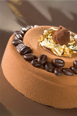 simsearch:825-06046985,k - Coffee and chocolate iced cake garnished with truffles Stock Photo - Rights-Managed, Code: 825-03629052