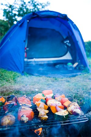 Vegetable Kebab Skewers Grilling On Campfire With Tent In Background Stock Photo - Rights-Managed, Code: 832-08007472