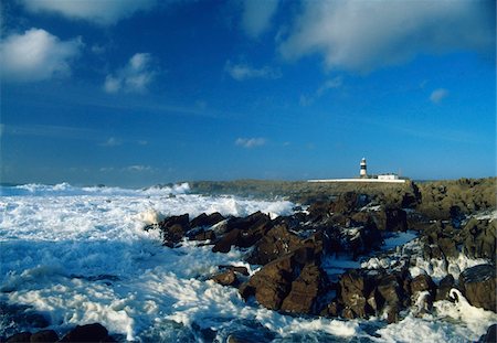 L'île de Toraigh, comté de Donegal, en Irlande ; Paysage marin avec phare au loin Photographie de stock - Rights-Managed, Code: 832-03232948