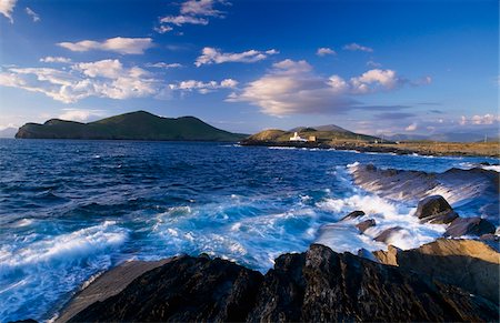 Lighthouse in the distance, Fort Point, Valentia Island, County Kerry, Ireland Fotografie stock - Rights-Managed, Codice: 832-03233247
