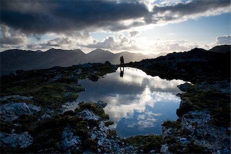 Maumturks, Co Galway, Ireland;  Person near the summit of Knocknahillion Stock Photo - Rights-Managed, Code: 832-03233709