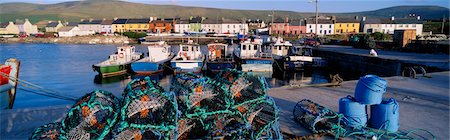 Fishing boat moored at a harbor, Portmagee Harbor, Ring Of Kerry, County Kerry, Republic Of Ireland Foto de stock - Con derechos protegidos, Código: 832-03358734