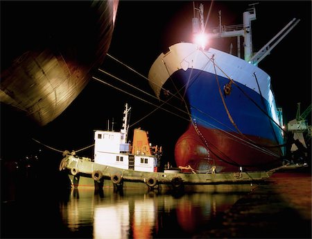 Shipping;  Ship and boat illuminated at night Stock Photo - Rights-Managed, Code: 832-03359013