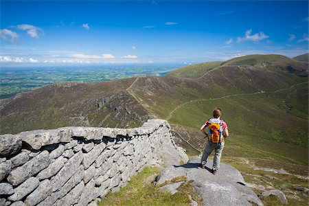 enjoy mountain view - Mourne Mountains, Co Down, Ireland;  Hiker beside the Mourne Wall on the slopes of Slieve Bearnagh Stock Photo - Rights-Managed, Code: 832-03359304