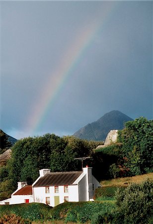 rainbow in architecture - Sugarloaf Mountain, Glengarriff, Co Cork, Ireland; House With A Rainbow And Mountain In The Distance Stock Photo - Rights-Managed, Code: 832-03640098
