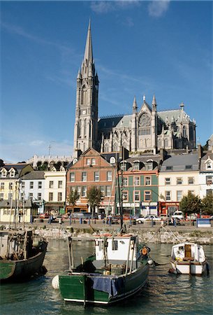 St. Colman's Cathedral,Cobh,Co Cork,Ireland;Fishing Boats In Harbor,Streetscape,And Cathedral Stock Photo - Rights-Managed, Code: 832-03640416