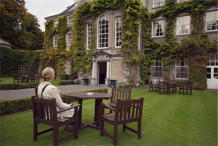 Person Seated Outside Ivy-Covered Mansion Stock Photo - Rights-Managed, Code: 832-03640917