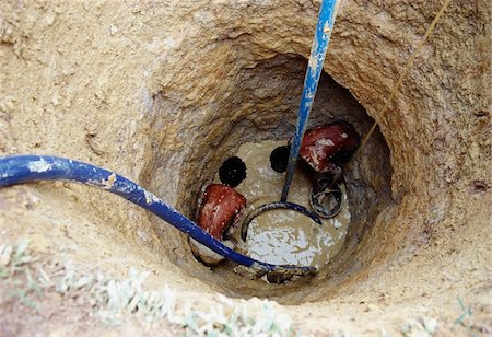 Two men digging a well Stock Photo - Rights-Managed, Code: 832-03724433