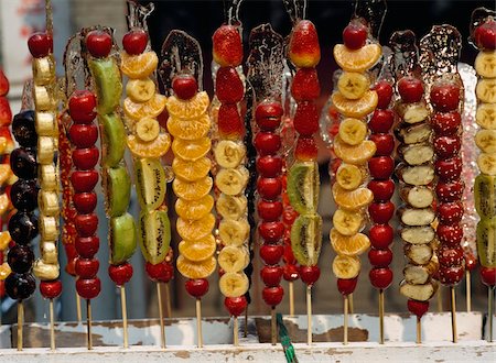 Sugared fruits on sale in a market Foto de stock - Con derechos protegidos, Código: 832-03724497